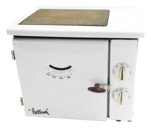 A 1950s Baby Belling white enamel electric table cooker, 31cm high, 34cm wide, 28cm deep.
