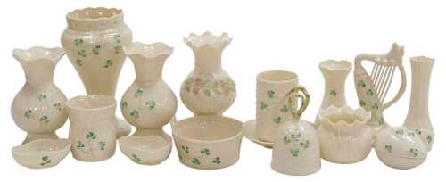 A group of Belleek porcelain Shamrock pattern vases, salts, a mug, harp, bell, etc. (a quantity)