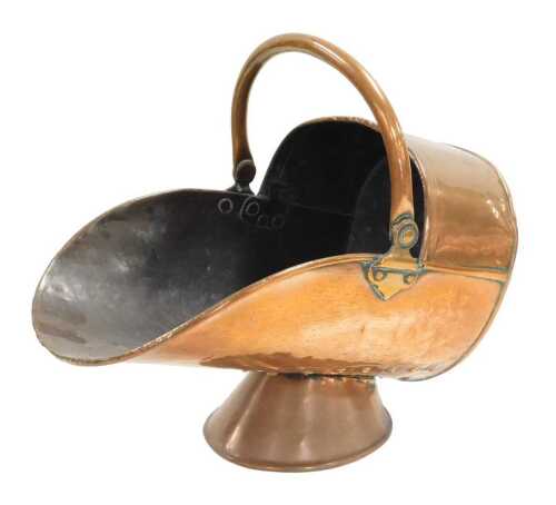 A Victorian copper helmet shaped coal scuttle, 49cm wide.
