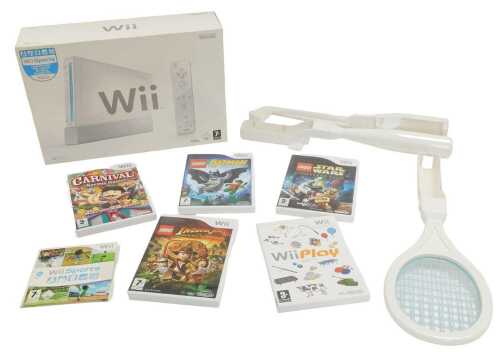 A Nintendo Wii, boxed, together with five games, Lego Batman, Indiana Jones The Original...