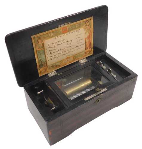 A late 19thC Swiss faux rosewood cased music box, playing six airs, 29cm wide.