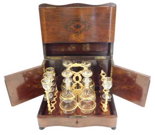A late 19thC Napoleon III Cave &agrave; Liqueur rosewood liqueur cabinet, with inlaid escutcheons and...