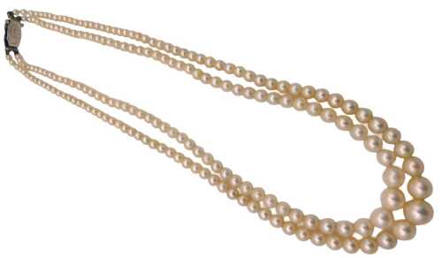 A double strand of graduated cultured pearls, on a silver and marcasite set clasp.