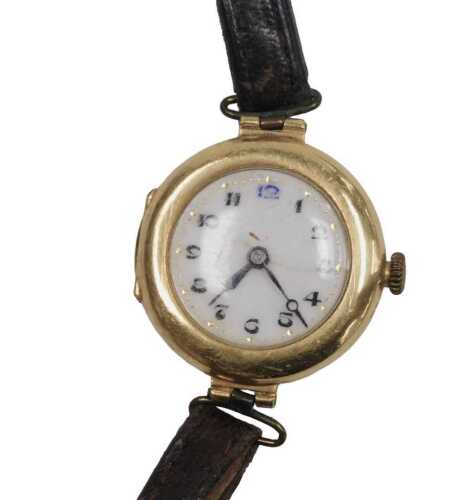 A mid century lady's 18ct gold cased wristwatch, circular enamel dial bearing Arabic numerals,...