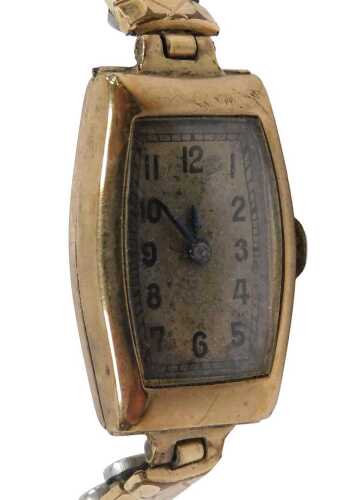 A mid century lady's 9ct gold cased wristwatch, rectangular silvered dial bearing Arabic...