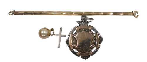A George V silver and gilt sporting medal, centred on a shield with a crown surmount, verso...