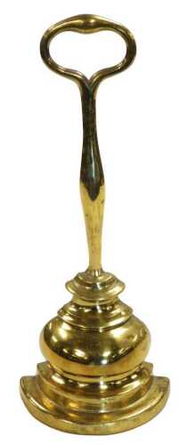 A Victorian cast iron loaded brass demi lune doorstop, 36cm high.