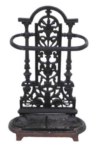 A Victorian style cast iron stick stand, the back cast with an urn of scrolling leaves, above...