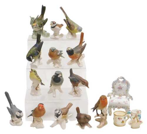 A group of Goebel bisque porcelain figures of birds, together with a Continental porcelain...
