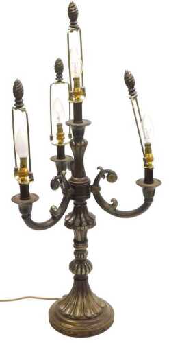 A bronzed metal four branch table lamp, of fluted form, 83cm high.
