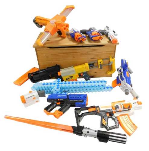 A pine toybox, containing Nerf N-Strike, Double Dealer Doomlands, Strong Arm, X-Shot, and other...