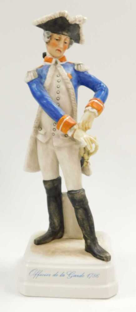 A Royal Worcester porcelain figure of a Swiss man playing an alphorn ...