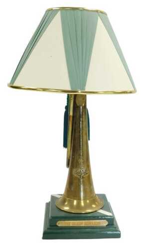 A novelty military table lamp, formed from a brass bugle, bearing the crest of the Green Howards,...