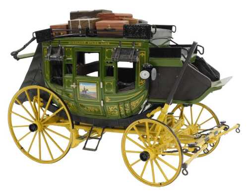 A Franklin Mint Precision diecast model of a John Wayne stagecoach.
