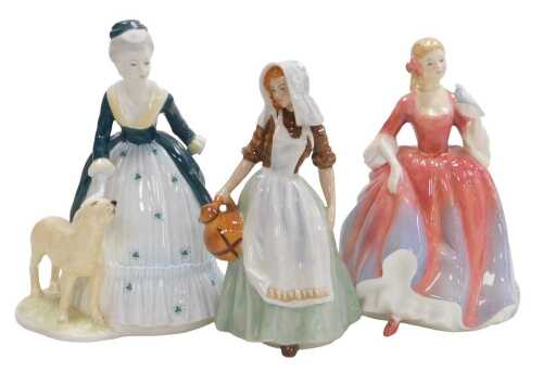 Two Royal Doulton figures, modelled as The Milkmaid HN2057, and Nicola HN2804, together with a...