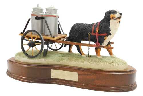 A Border Fine Arts figure group modelled as a Burnese Mountain dog, pulling milk churns on a...