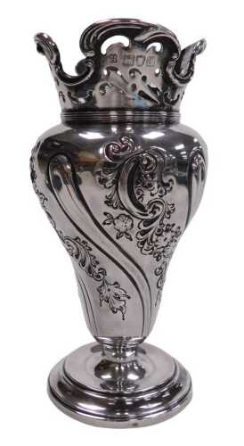 A Victorian silver vase, of ogee form, with fluted and embossed floral and foliate scroll...