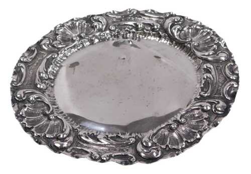 A Continental salver, the rim embossed with rococo scrolls, foliate leaves, and C scrolls, white...