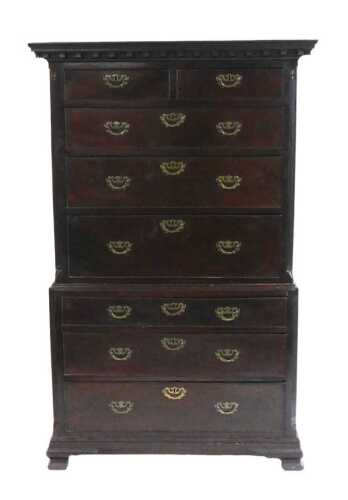A George III mahogany chest on chest, the top with a moulded dentil cornice, above two short and...