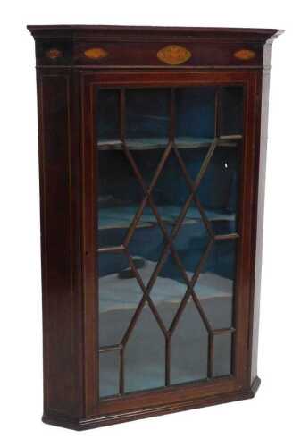 A 19thC mahogany corner cabinet, the cornice inlaid with oval marquetry fleur de lys and shells,...