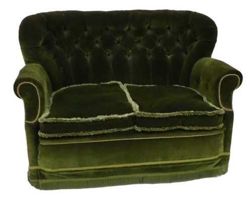 A small Victorian mahogany sofa, with a button back, loose cushions with piped borders, on...