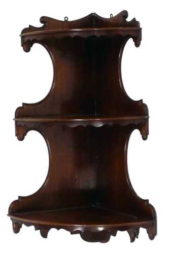 A 19thC mahogany corner wall shelf, with a moulded raised top, above three shelves with wavy...