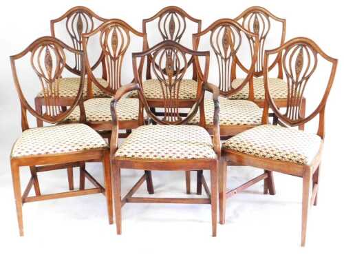 A set of eight 19thC George III style mahogany dining chairs, each wth a shield shaped back with...