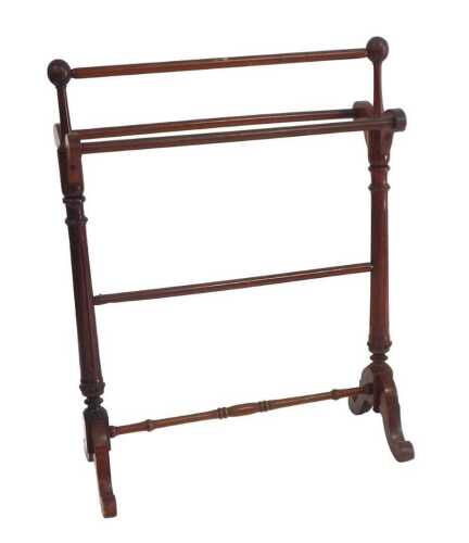A Victorian walnut towel rail, with fluted turned supports, on cabriole legs, 89cm wide.