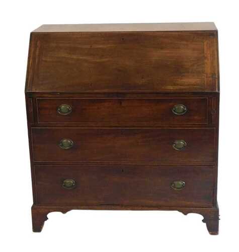 A George III mahogany bureau, the fall enclosing a fitted interior above four graduated drawers...