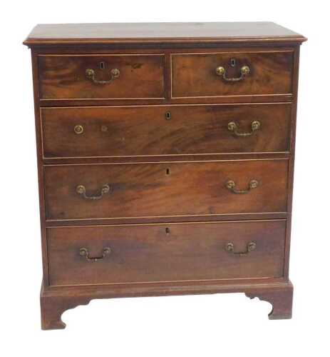 A George III mahogany chest of drawers, the rectangular top with a moulded edge above two short...