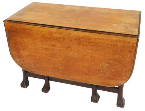 An early 20thC Georgian style mahogany drop leaf dining table, raised on eight cabriole legs and...