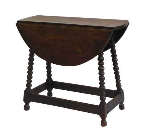 A small oak oval drop leaf table, on bobbin turned supports, 58.5cm high, 67cm wide, 24cm deep.