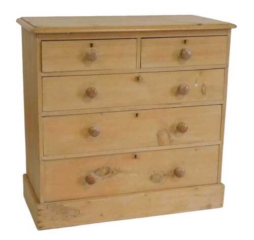 A Victorian pine chest of drawers, the rectangular top with a moulded edge, above two short and...