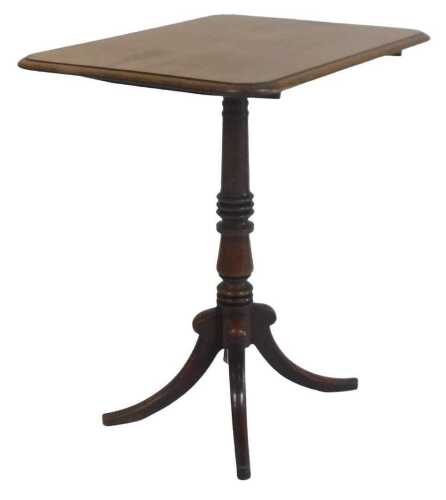 A Victorian mahogany occasional table, the rectangular tilt top with a moulded edge, on a turned...