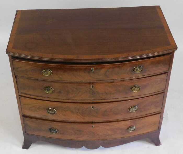 A George III mahogany bow fronted chest of drawers, the tulipwood ...