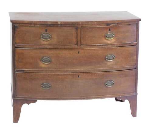 An early 19thC mahogany bow front chest of drawers, with two short and two long drawers, with...