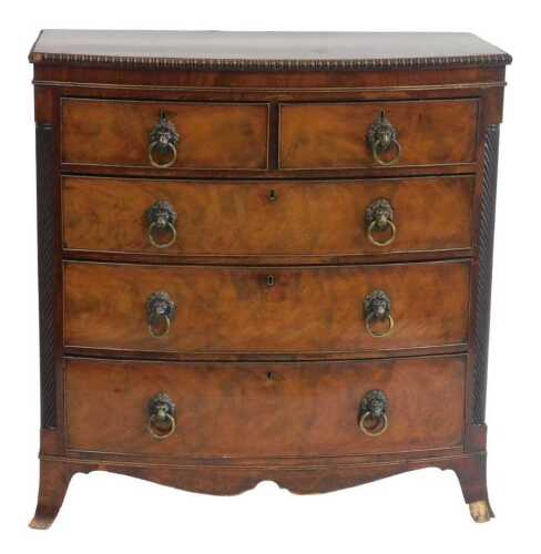 A William IV bow front chest of drawers, the top with a gadrooned edge, above two short and...