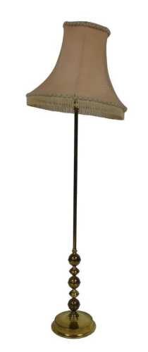 A brass standard lamp, with a pink damask shade, 163cm high.