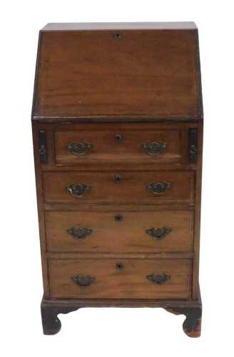 A small Edwardian mahogany and chequer banded bureau, the fall enclosing a fitted interior above...