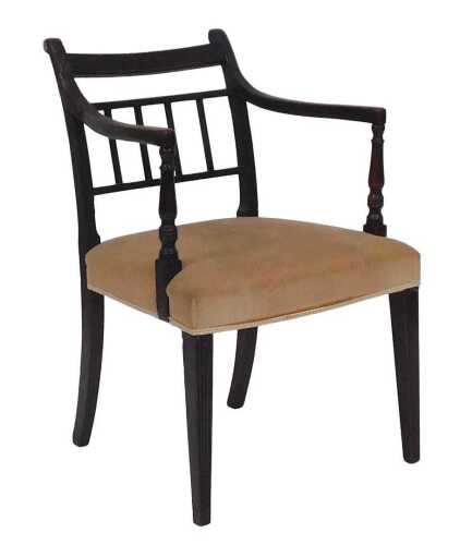 A Regency mahogany open armchair, with a reeded frame, and padded seat, on square tapering legs.