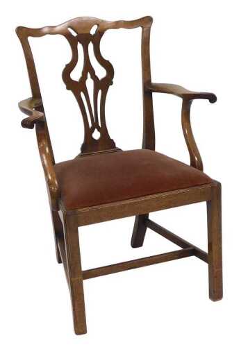 A George III Hepplewhite style mahogany carver chair, with a pierced vase shaped splat, red...
