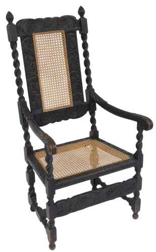A late Victorian 17thC Revival oak carver chair, with a carved floral, foliate and cane back,...