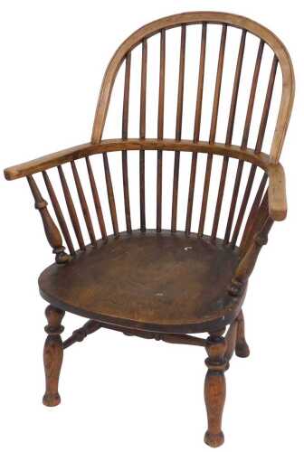 A 19thC oak and elm Windsor chair, with a solid saddle seat, the seat rail stamped JK, raised on...