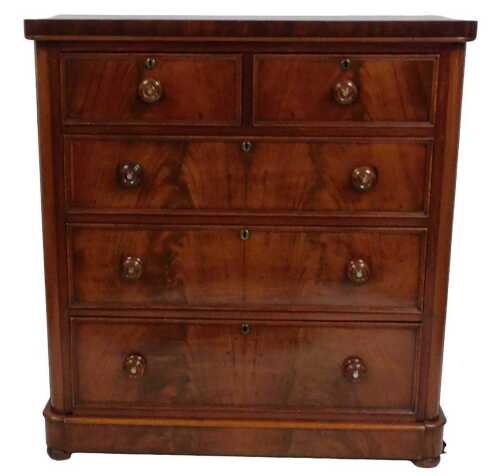A Victorian mahogany chest of drawers, with two short and three long drawers, each with turned...