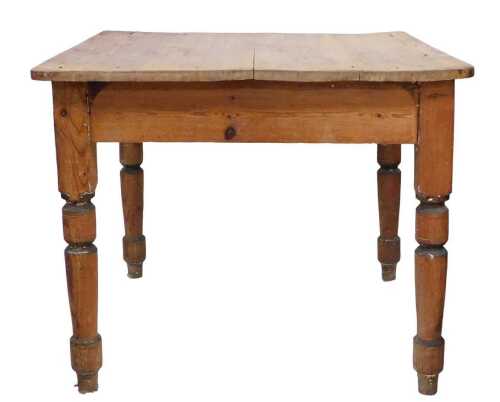 A Victorian pine scrub top kitchen table, the rectangular top raised on turned legs, 69cm high,...