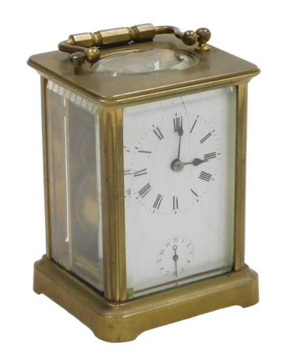 A late 19thC brass alarm carriage clock, rectangular fascia with circular enamel dial bearing...