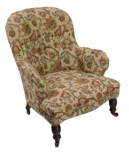 A Victorian mahogany armchair, with a button back and padded seat, upholstered in floral fabric,...