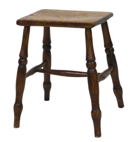 An early 20thC beech and fruitwood stool, with a rectangular top, on turned legs, with a H frame...