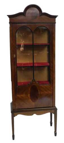 An early 20thC mahogany display cabinet, with a single glazed door, glazed sides, on square...