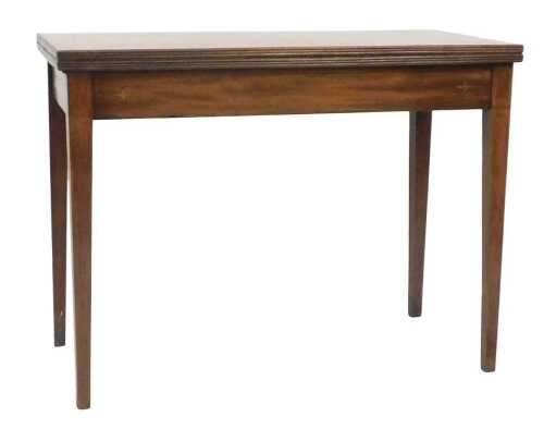 A 19thC mahogany and boxwood strung foldover tea table, the rectangular top with a reeded edge,...